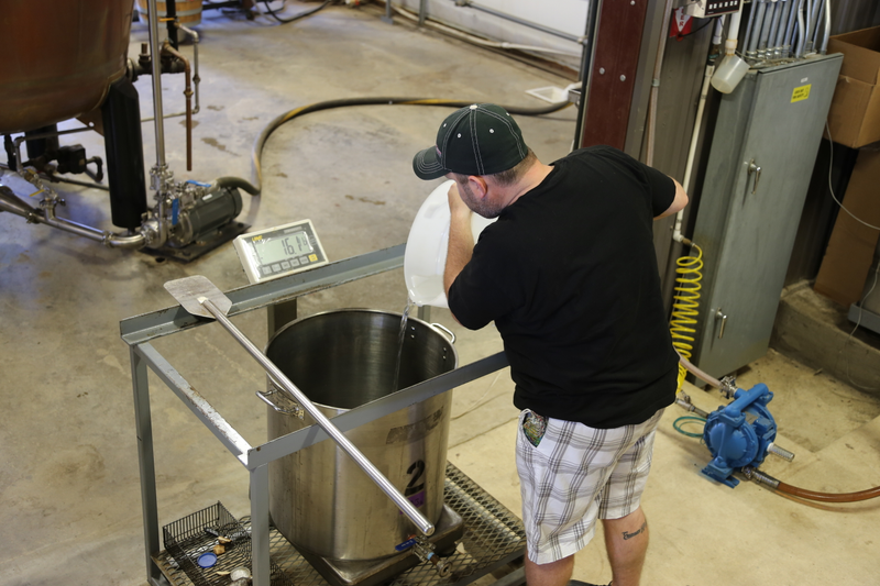Add Hill Country rain water to dilute the liquor to 92 proof